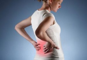 Woman in back pain